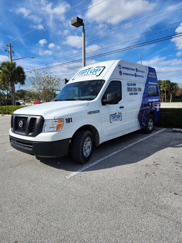 Tip Top Plumbing & Restoration Work Van