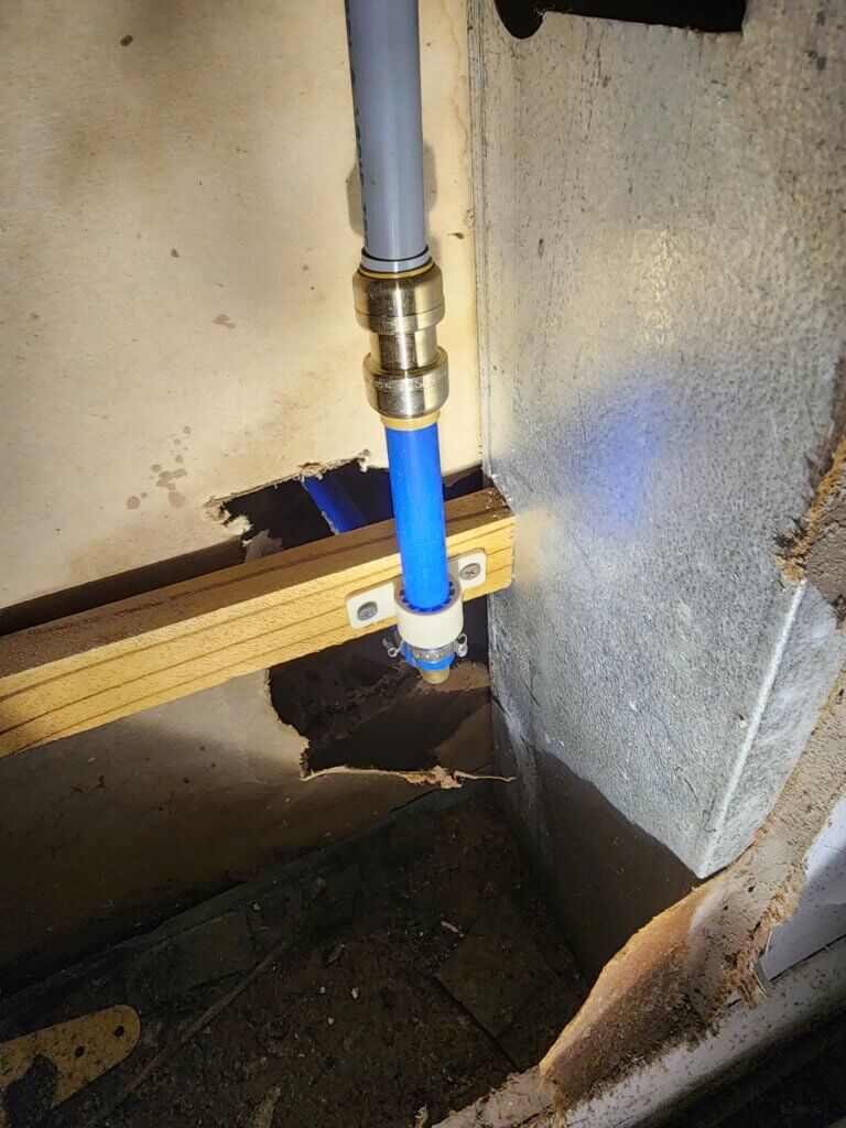 Polybutylene Pipe Repair at Bathroom Toilet Connection.