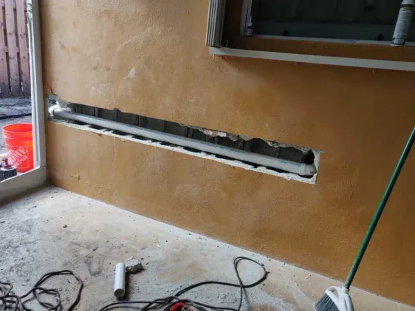 Tip Top Plumbing’s professional water heater installation in a South Florida home, featuring clean copper pipework, an expansion tank, and a properly mounted shutoff valve system for safe, reliable performance.