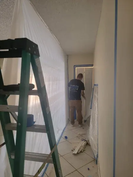 A professional mold remediation setup in a Broward County home with clearly defined containment areas, HEPA filtration systems, and sealed plastic barriers. Tip Top Plumbing emphasizes the importance of certified remediation techniques for safety and long-term protection.