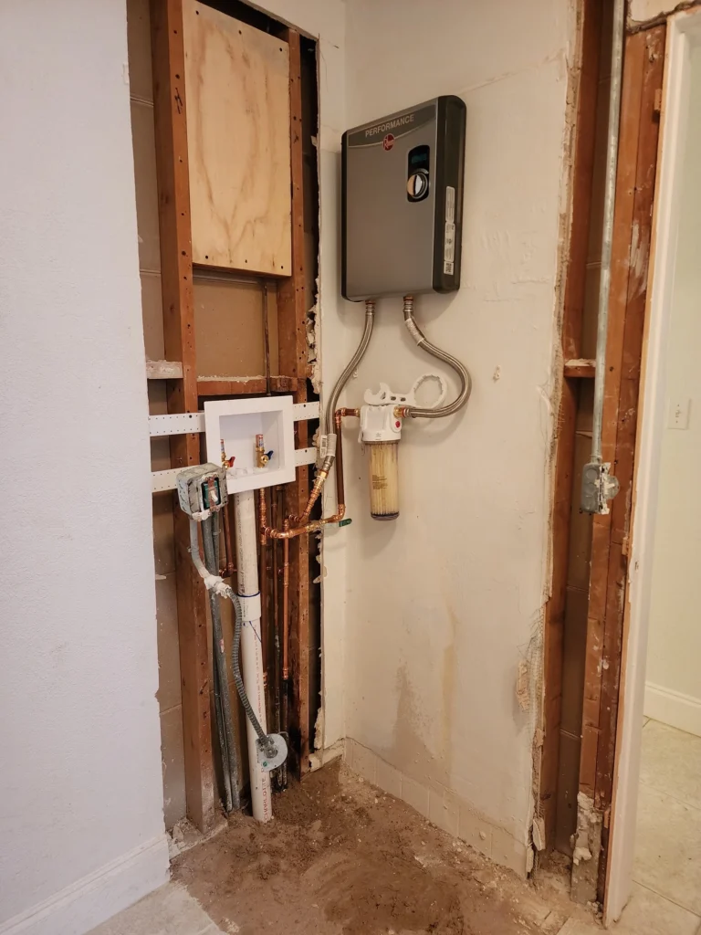 TipTop Plumbing installing a water heater in Weston