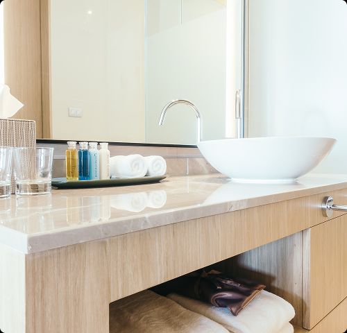 Modern bathroom vanity with vessel sink installed by Tip Top Plumbing & Restoration in Pompano Beach Highlands FL.