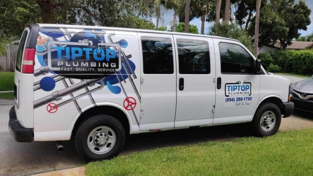 Tip Top Plumbing & Restoration service van parked in a Sunrise FL residential neighborhood