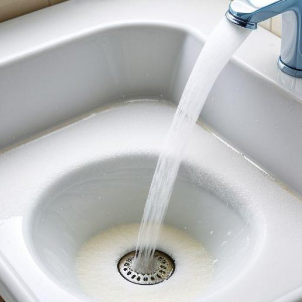 Vinegar and Baking Soda Drain Cleaning for Mold Prevention Baking soda and vinegar reacting in a bathroom sink drain to clean and remove mold, organic buildup, and odors from household plumbing.